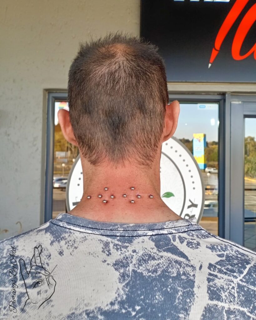 Nape surface piercing 
